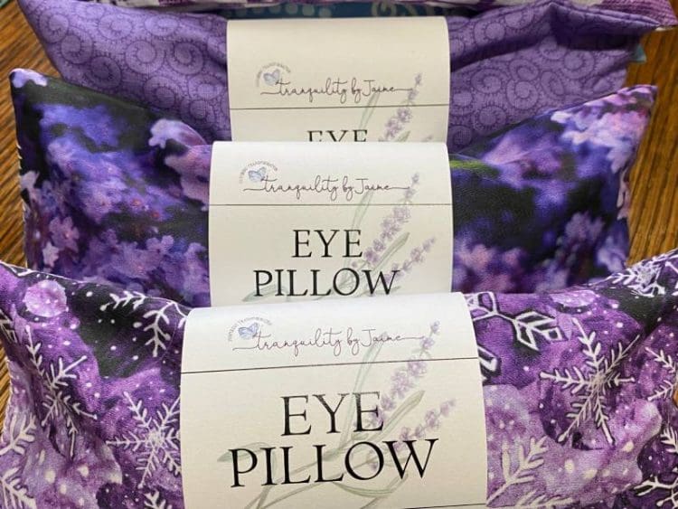 Three lavender eye pillows in purple organic fabric